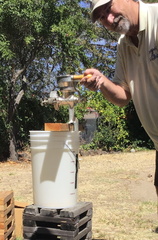 Jack milling the grains- by hand