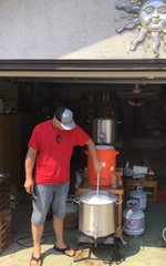 Jack's nephew, JJ, stirring the boil